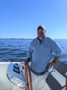 PJ at the helm of his boat